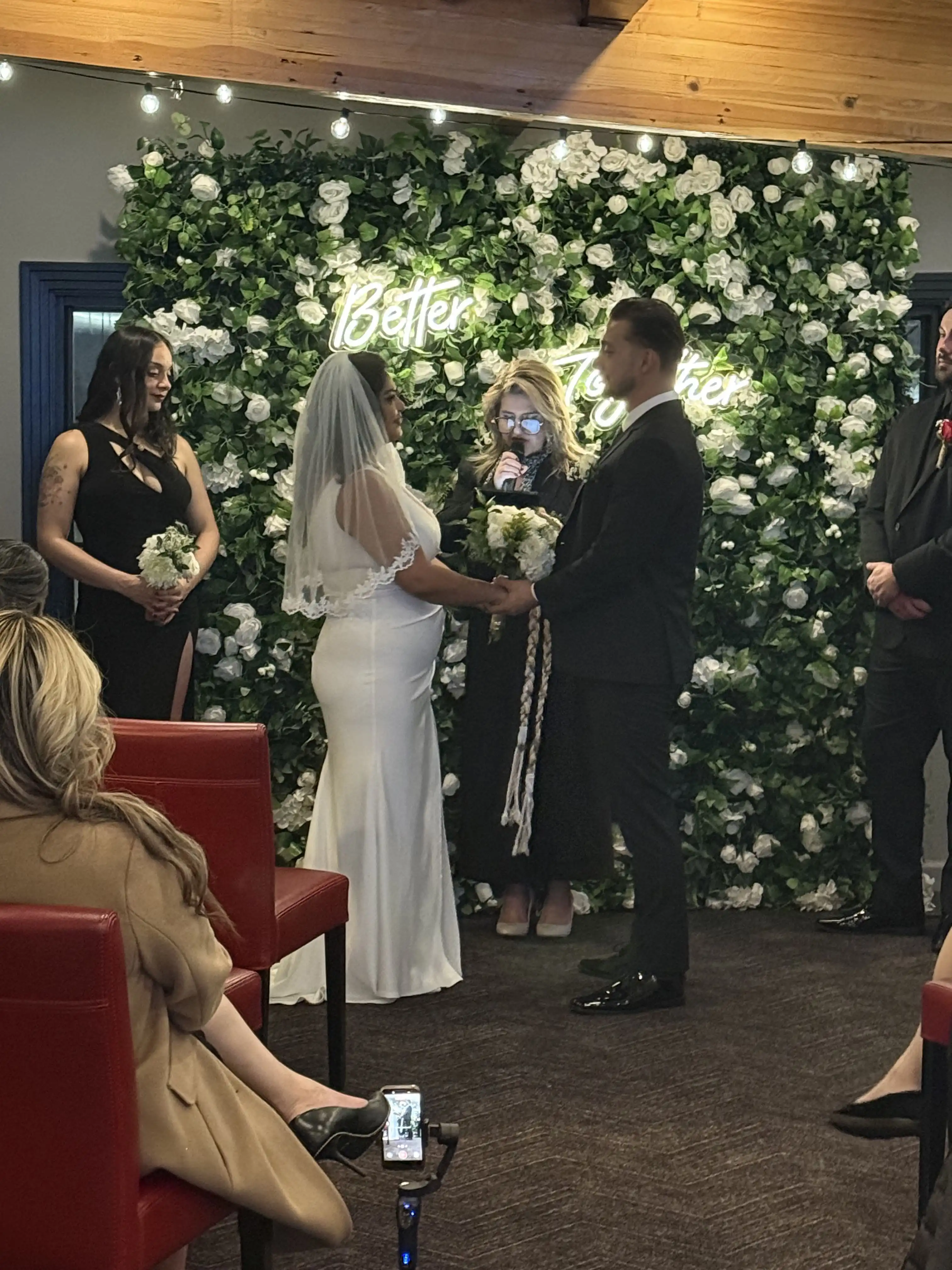 A couple celebrating their wedding ceremony in the Syrah Suite at Domenico Winery