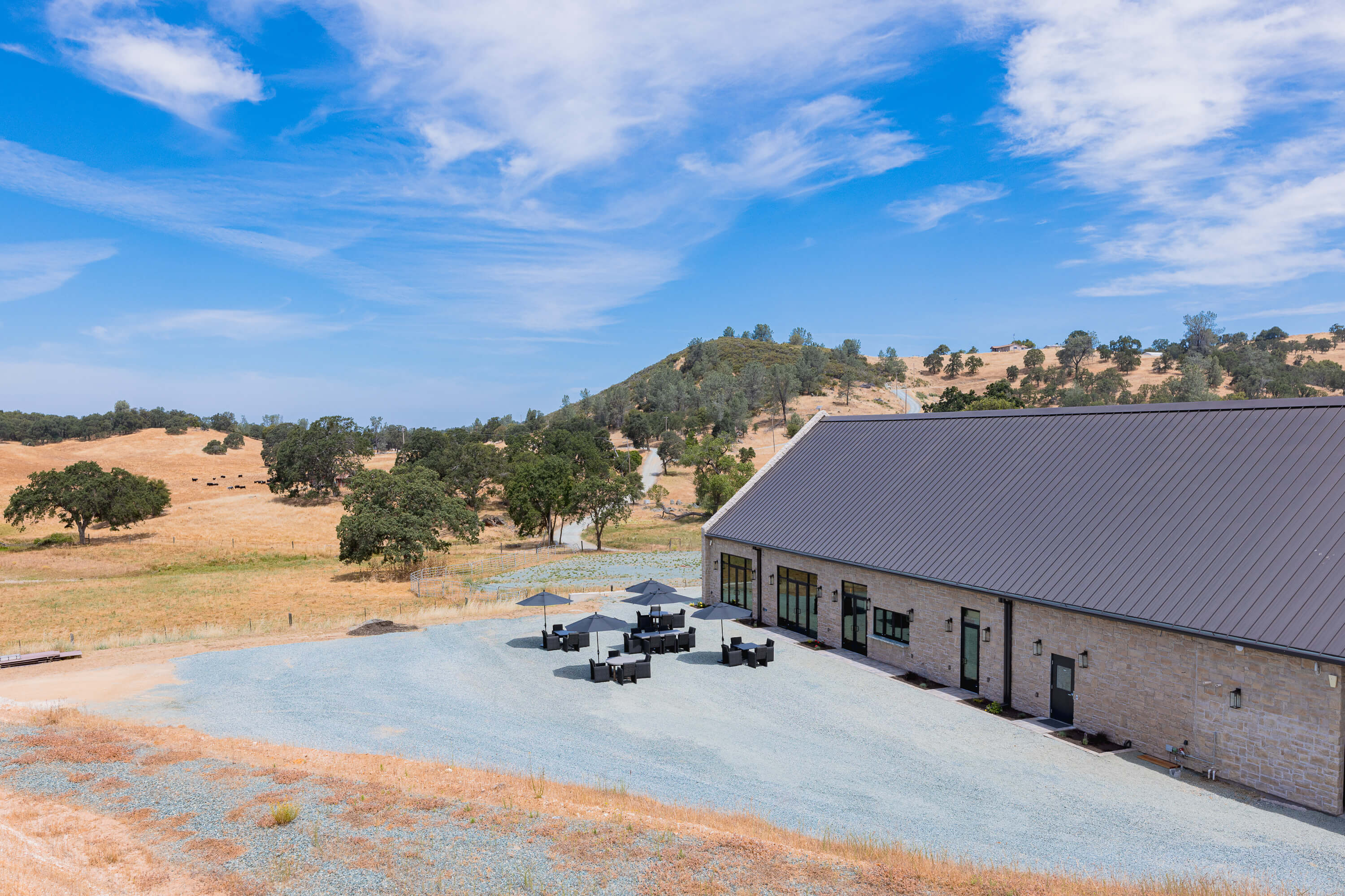 An aerial image of Domenico Winery in Amador with patio overview and tasting room for wine and events inside
