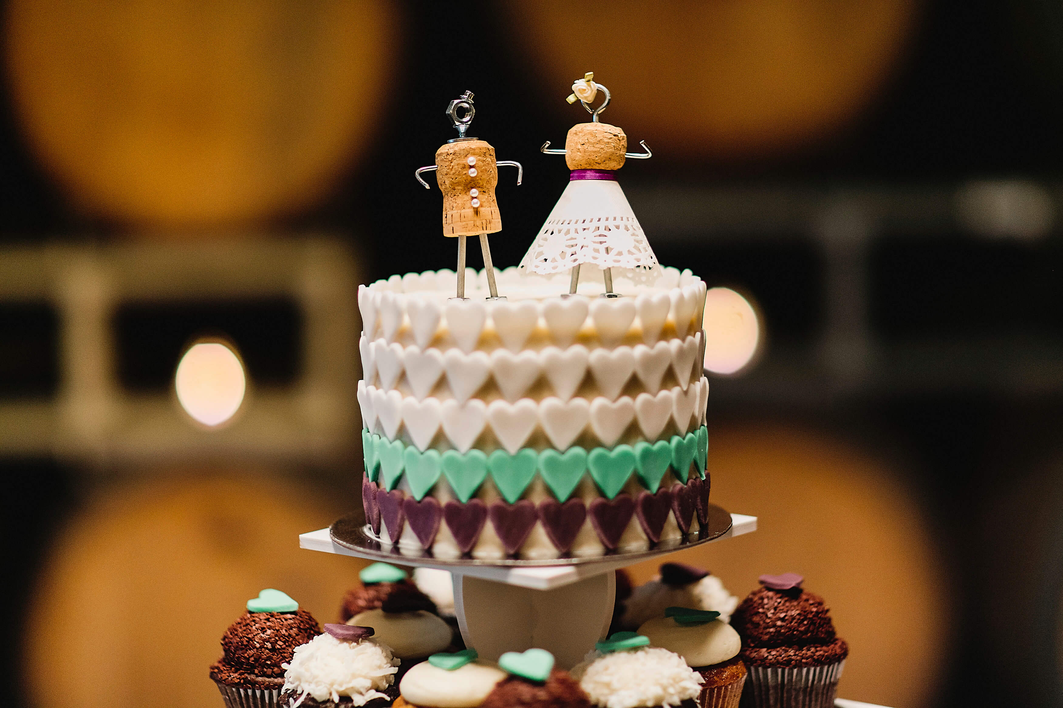 A wedding cake with stick figure bride and groom at Domenico Winery San Carlos