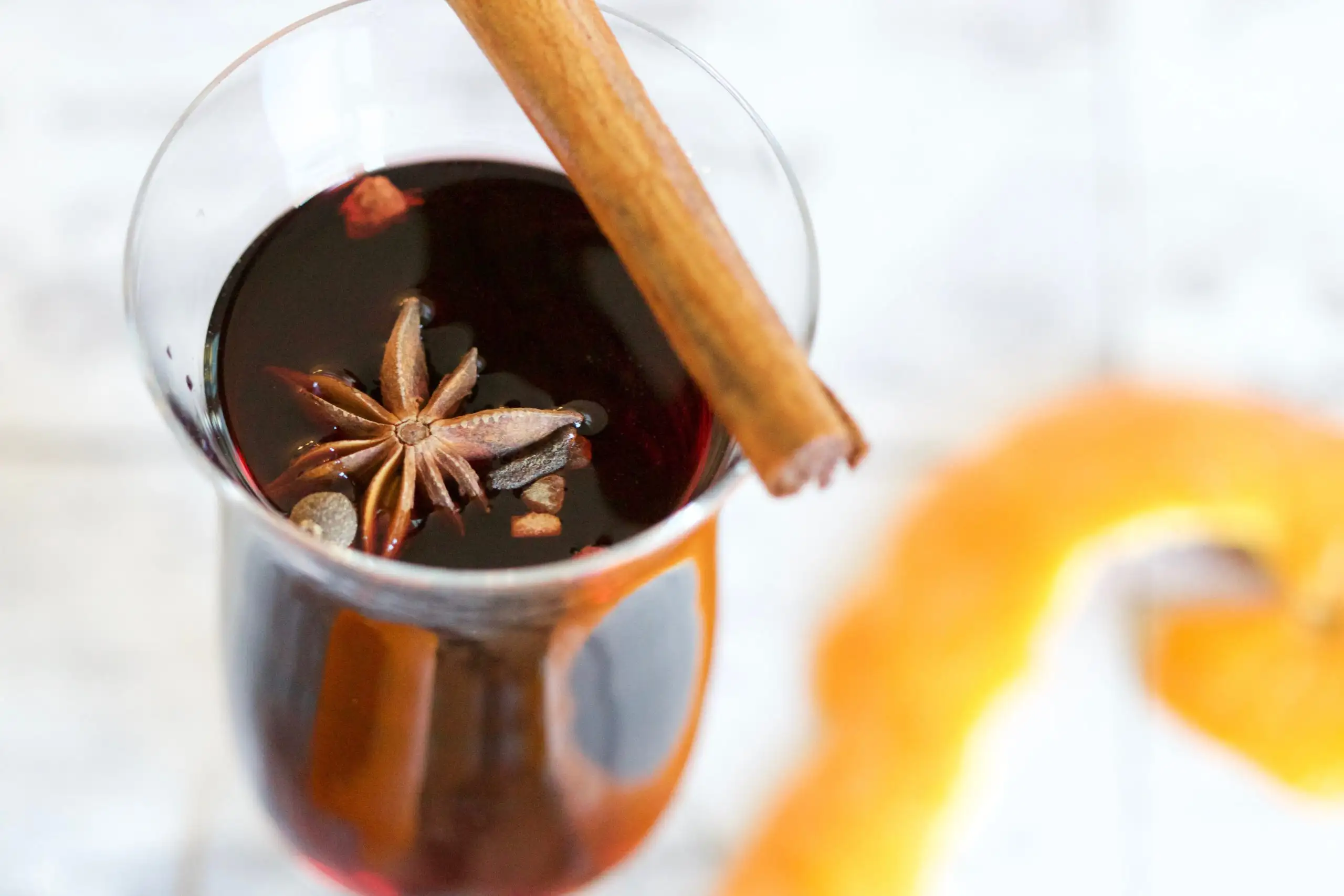 Close-up of mulled wine with star anise and cinnamon stick for decoration